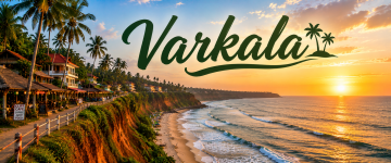 Sunset view of Varkala Cliff overlooking the Arabian Sea with beachside cafés and palm trees.