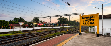 Aluva railway station in Kerala with railway tracks and station signboard