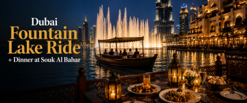 Traditional abra boat cruising in front of the Dubai Fountain with dinner overlooking Burj Khalifa at night.