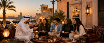 Emirati host sharing Arabic coffee and dates with young visitors in a traditional majlis