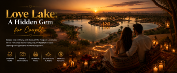 Couple watching sunset over the heart-shaped Love Lake in Dubai surrounded by lanterns and romantic décor.