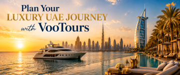 Luxury yacht cruising past Dubai skyline with Burj Al Arab and Burj Khalifa during sunset.